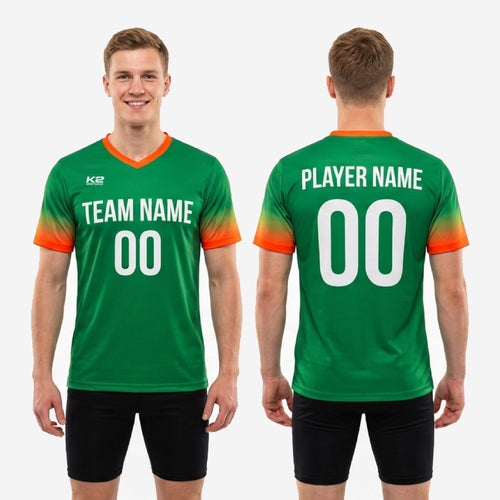 Full body view of custom Kelly Green and orange soccer training jersey on male model, showing athletic cut and all print zones