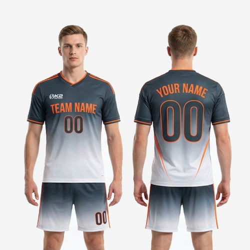 Complete custom grey soccer uniform set with Charcoal and Orange design available in youth and adult sizes YS through 3XL