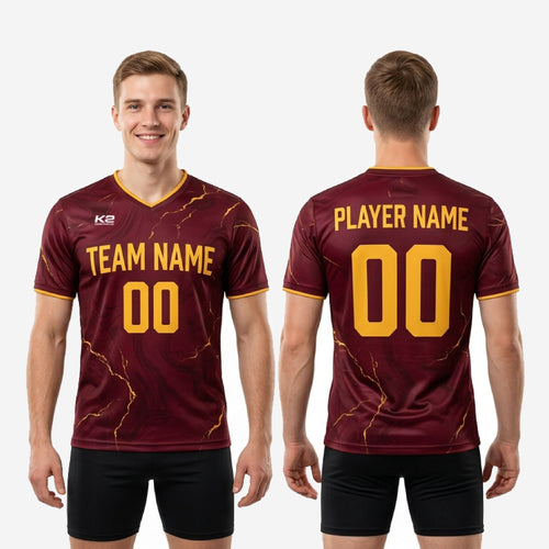 Close-up of Athletic Gold marble sublimation print on custom maroon soccer training jersey fabric