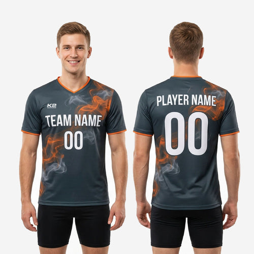 Orange contrast trim on sleeve cuff of custom mens soccer training top in graphite smoke print