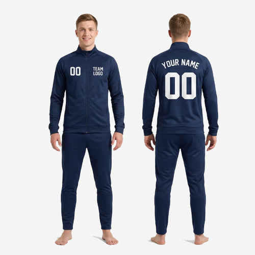 Ankle detail of custom navy soccer tracksuit tapered pants showing ribbed hem and hex dot sublimation pattern