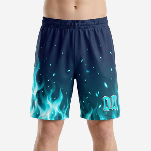 Custom navy basketball shorts with cyan blue flame pattern rising from the hem and glowing spark field, player number 00 on right thigh, front view