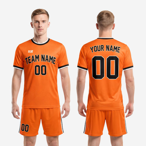 Full set view of orange and black sublimated soccer team uniform kit