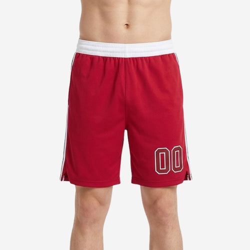 Custom rec league basketball shorts in red with white elastic waistband, navy and white side stripe, and white-outlined player number on the left thigh - front view