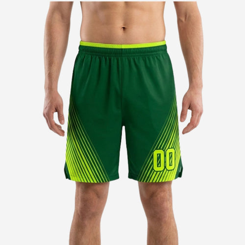 Travel team basketball shorts in forest green and volt with diagonal speed-line panels and player number 00 at the lower right thigh, front view
