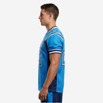 Side view of sublimated american football jersey in sky blue showing navy side panel running from underarm to straight hem