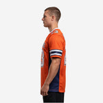 Left side view of orange sublimated football jersey showing full-length navy side panel and set-in sleeve construction on adult male