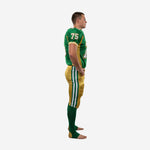 Side view of green and gold american football team uniforms showing gold pants with green and white double side stripe running the full outer leg length
