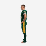Custom american football uniform packages green and gold colorway, opposite side view showing crew neck jersey and full-length compression pants