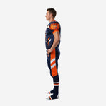 Side view of navy custom american football uniform showing set-in sleeve, orange shoulder cap flame print, and orange pant side panel