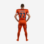 Opposite side view of american football uniform sets for teams in orange and navy showing sleeve number placement and pant stripe continuity