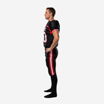 Black and red football uniform side view showing full-length pants with red and white double outer-leg side stripe from hip to ankle