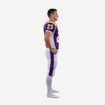 Custom sublimated American football uniform side view showing white mesh side panel on purple jersey and purple leg stripe with gold edge on white pants
