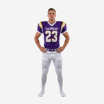American football uniforms for teams in purple and white with gold trim, V-neck jersey showing team name and number 23 on chest, matching white game pants with purple side stripe, front view