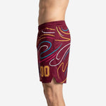 Right-side view of maroon club basketball shorts with multicolor swirl design and elastic waistband detail