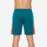 Back view of custom basketball shorts for leagues in teal and coral showing back name and number print zones