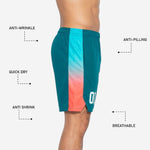Close-up detail of the gradient side panel on teal basketball uniform shorts, highlighting the cyan-to-coral sublimated fade