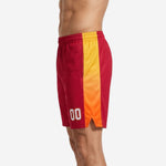 Opposite side view of red and gold custom basketball team shorts showing gradient panel and athletic cut leg opening