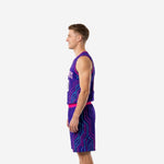 Side view of purple and pink basketball tournament uniform showing circuit-board pattern running down jersey and shorts leg panels