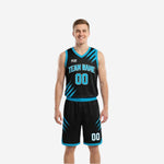 Black and blue reversible basketball uniforms front view showing black side with cyan slash-panel graphics, arced team name, and front number
