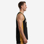 Front view of custom black and gold basketball jersey showing white arched team name with gold outline and large block number 23