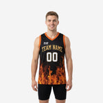 Custom black and gold basketball jerseys with photorealistic flame pattern rising from the hem, V-neck orange binding, and gold arched team name on the front chest