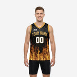Custom black and gold basketball jerseys with full-panel flame sublimation, gold V-neck trim, arced team name on chest, and front number 00