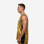 Side view of gold and black sublimated basketball jersey showing black side panel and straight hem with side vent detail