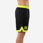 Left side view of custom black and gold basketball shorts showing neon yellow and white double side stripe running full leg length