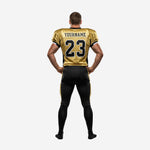 Back view of custom black and gold american football uniform showing back number placement on gold jersey and full-length gold side stripe on black football pants