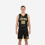 Black and gold reversible basketball uniforms showing both sides of the two-piece set with topographic-contour pattern and gold trim on the black side