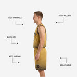 Close-up detail of black and gold matching basketball shorts showing dot-fade hex pattern and elastic drawcord waistband
