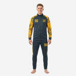 Custom black and gold soccer tracksuit in graphite and Athletic Gold marble print, full front view on male model