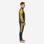 Black and gold soccer tracksuit side view showing Athletic Gold marble sleeve and leg panel on male model