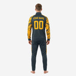 Black and gold soccer tracksuit jacket chest detail showing team logo and number printed in Athletic Gold