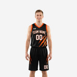 Black and orange basketball uniforms full set front and back view with claw-mark graphic on jersey and matching shorts
