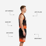 Full set view of black and orange basketball uniforms showing coordinating jersey and shorts worn by male model
