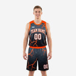 Custom black and orange basketball uniforms with orange lightning sublimation pattern, crew neckline, and matching shorts shown from the front on a male model