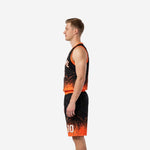 Left side view of black and orange custom basketball uniform set showing matching shorts waistband and jersey hem detail