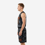 Side view of men's black and orange basketball uniform showing digital-camo shorts with orange player number on left thigh
