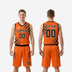 Size and specification chart for custom black and orange basketball uniform set in youth and adult sizing
