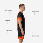 Close detail of black soccer uniform shorts with Athletic Orange gradient hem and sublimated player number on leg