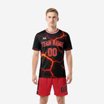 Black and red soccer uniforms with full-dye sublimation lava-crack print, front view on adult male model