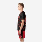 Black and red soccer uniforms right side view showing back name and number placement on lava-print jersey