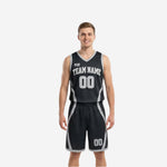 Custom black and white reversible basketball uniforms front and back view showing black side with silver-grey curved panels and white team name and number