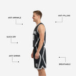 Opposite side view of black reversible basketball jersey and matching shorts with silver-gray curved trim panels