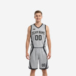 Custom reversible basketball uniform silver-gray side with black curved side panels team name and number 00 on chest and shorts