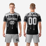 Back view of custom black and silver soccer uniform showing player name and number print zones on jet black sublimated jersey
