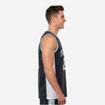 Custom black and white sublimation basketball jersey front close-up on male model with charcoal mesh body and white V-neck binding