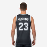 Right side view of black and white sublimation basketball jersey revealing full width of white contrast side panel and straight hem
